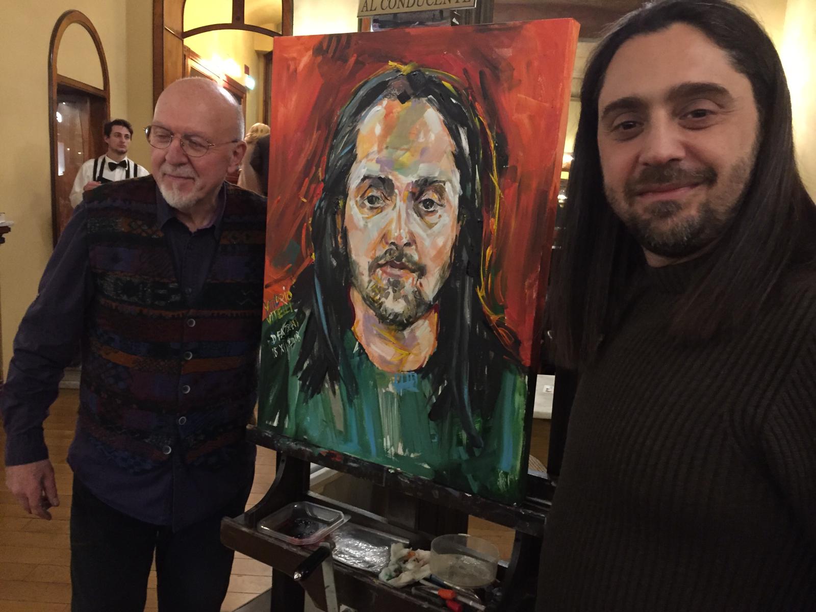 Caffè Meletti atelier d’arte, <br> il baritono Vittorio Vitelli <br> si mette in posa per un dipinto che….canta